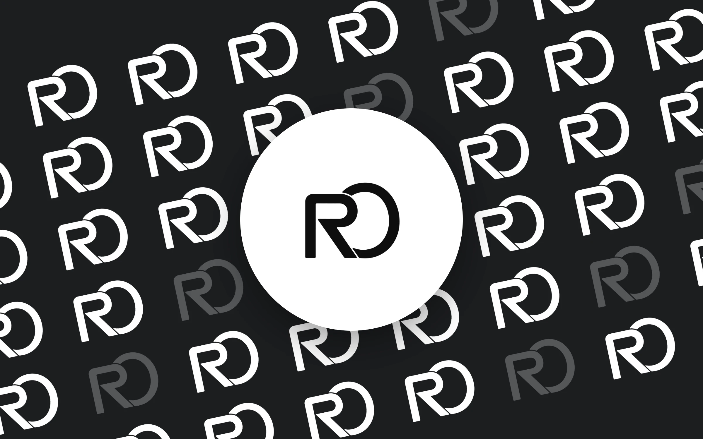 Pattern of repeated RO marks on charcoal with a white circle badge in the centre